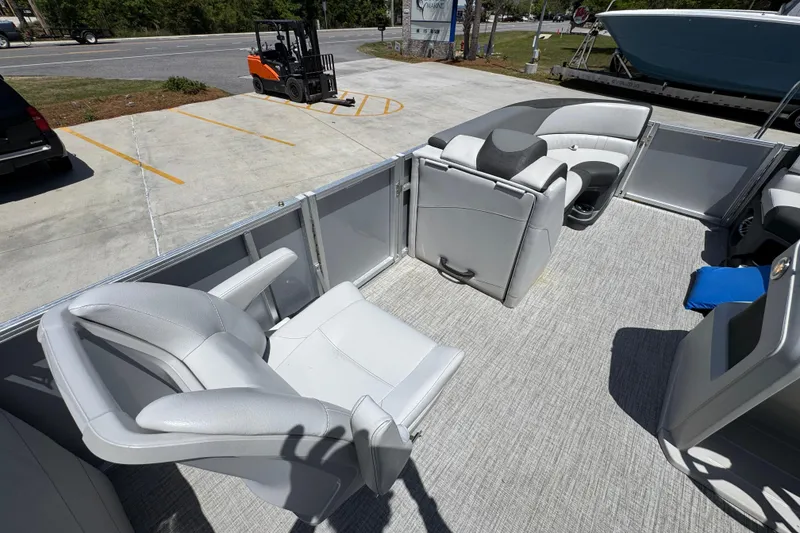 Slide: The Image of 2021 Avalon LSZ 2485 QL pontoon boat interior with gray seating and carpeted floor. - 26