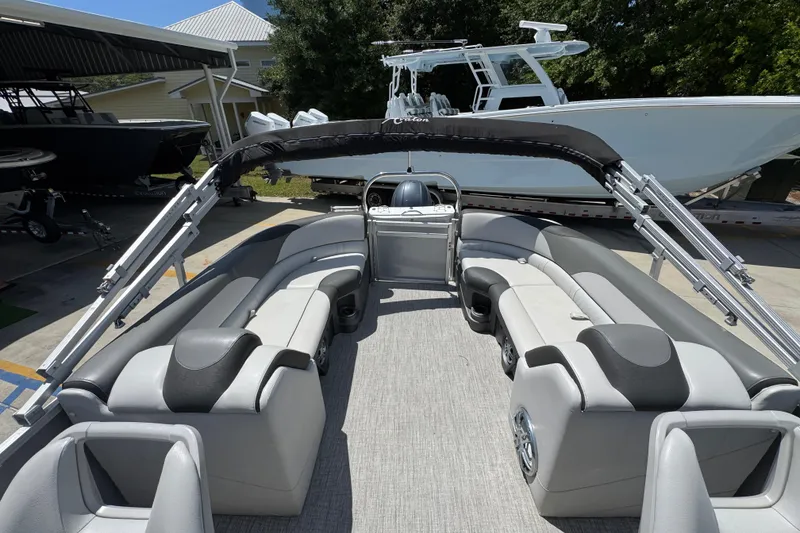 Slide: The Image of 2021 Avalon LSZ 2485 QL pontoon boat interior with gray seating and canopy. - 27
