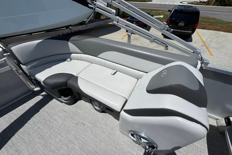 Slide: The Image of 2021 Avalon LSZ 2485 QL pontoon boat with stylish gray seating and modern design. - 29