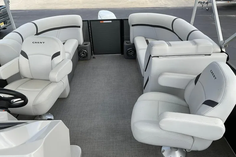 Slide: The Image of 2023 Crest Classic LX 200 SLC boat interior with plush seating and modern design. - 8