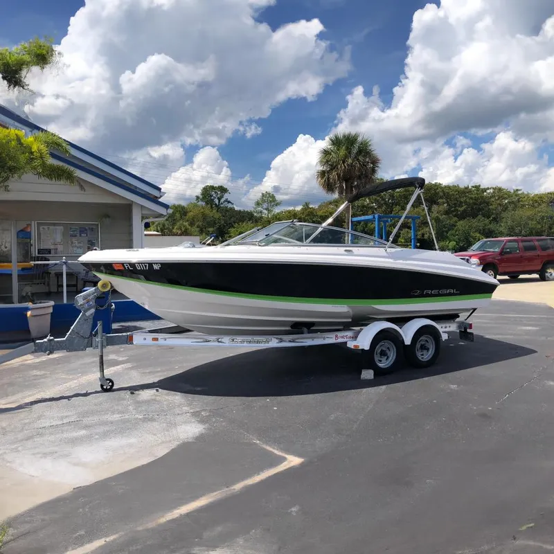 The Image of 2008 Regal 2000 Bowrider on trailer under blue sky. - 0