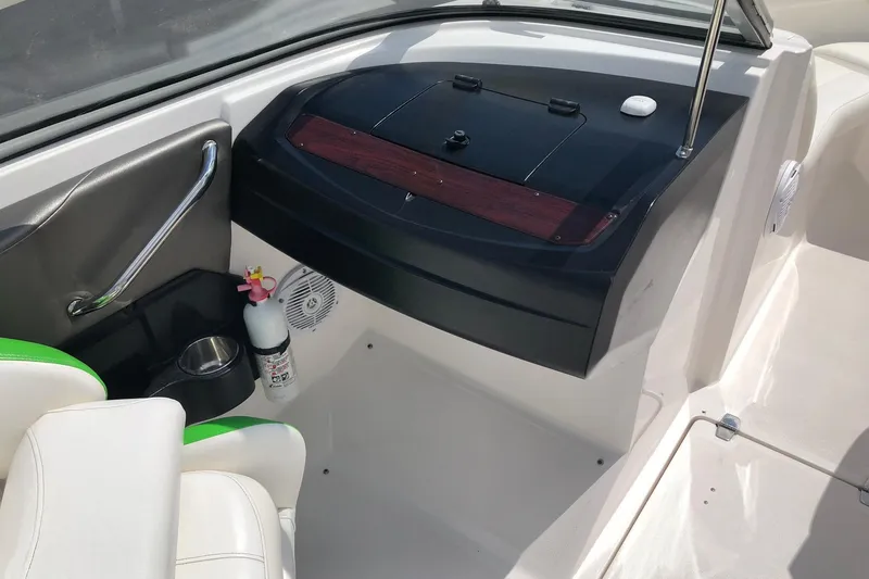 Slide: The Image of Interior of a 2008 Regal 2000 Bowrider boat with seating and safety equipment. - 12