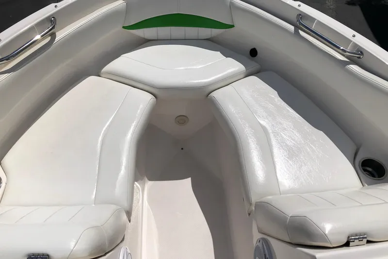 Slide: The Image of 2008 Regal 2000 Bowrider boat interior with white cushioned seating. - 14