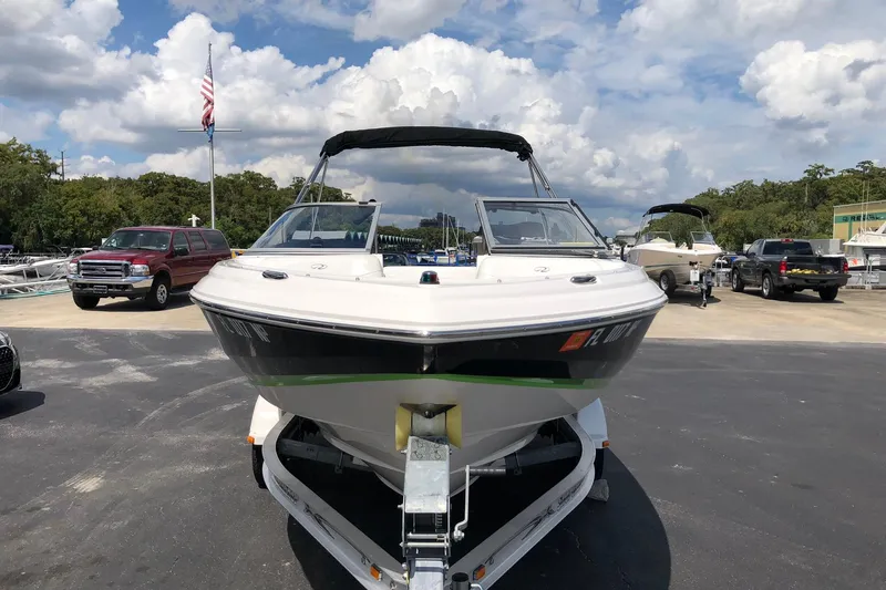 Slide: The Image of 2008 Regal 2000 Bowrider boat on trailer in marina parking lot. - 3
