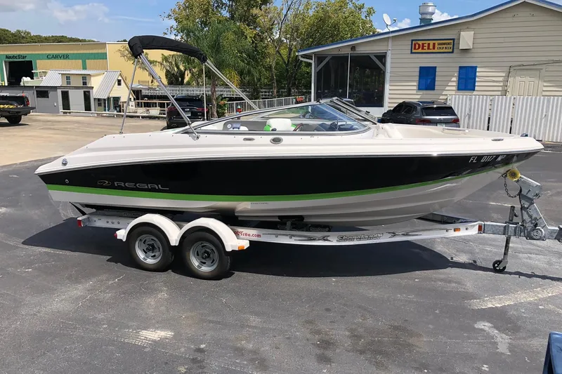 Slide: The Image of 2008 Regal 2000 Bowrider boat on trailer in parking lot. - 5