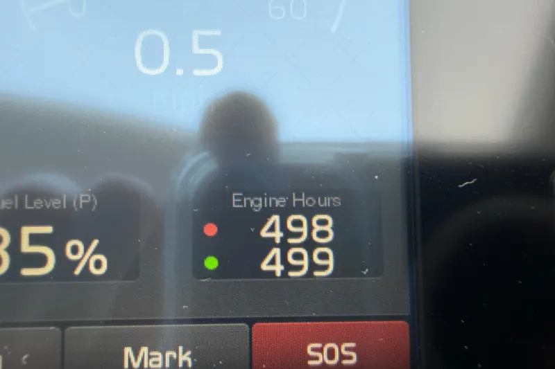 Slide: The Image of Display panel of 2018 Cruisers Yachts 50 Cantius showing engine hours and fuel level. - 19