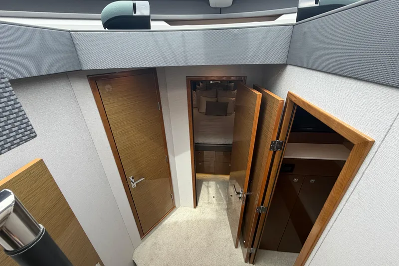 Slide: The Image of Interior view of 2018 Cruisers Yachts 50 Cantius with wooden doors and modern design. - 21