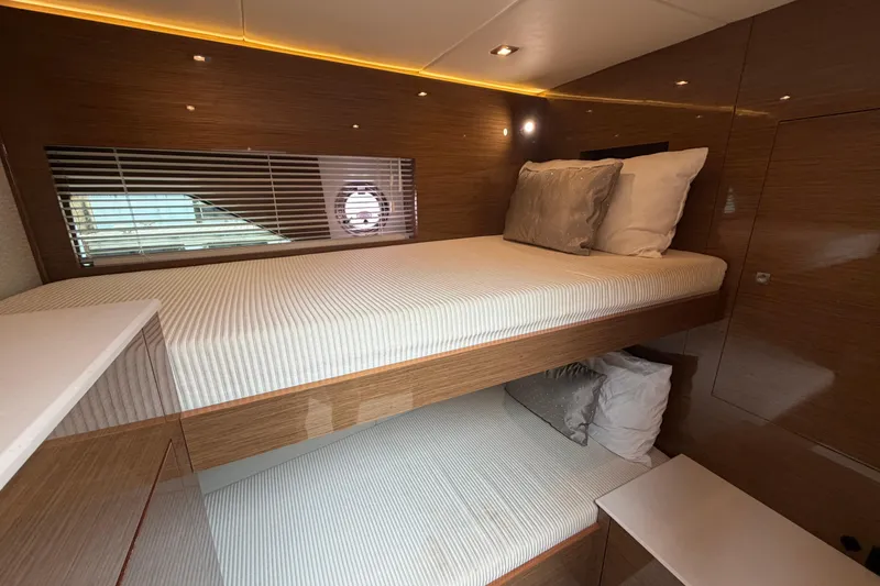 Slide: The Image of Luxurious 2018 Cruisers Yachts 50 Cantius cabin with modern wood finish and cozy bedding. - 22