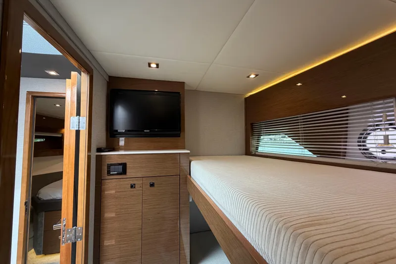 Slide: The Image of Interior of 2018 Cruisers Yachts 50 Cantius with TV and cozy bed. - 23