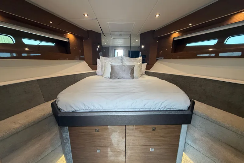 Slide: The Image of Luxurious bedroom interior of 2018 Cruisers Yachts 50 Cantius with elegant bedding and ambient lighting. - 24