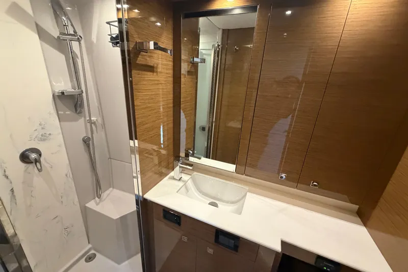 Slide: The Image of Luxurious bathroom in 2018 Cruisers Yachts 50 Cantius with modern fixtures and wood accents. - 32