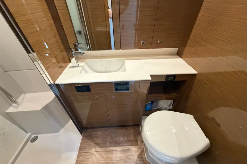 Slide: The Image of Luxurious bathroom in 2018 Cruisers Yachts 50 Cantius with modern fixtures and wood accents. - 33