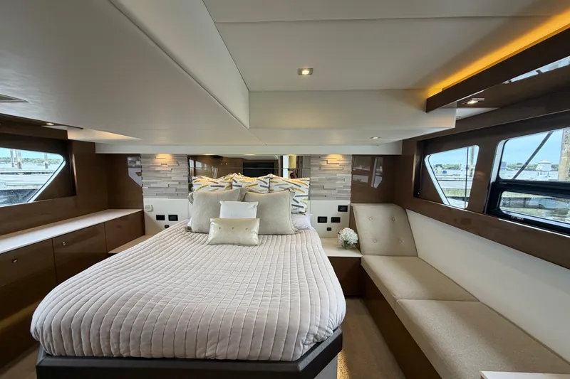 Slide: The Image of Luxurious 2018 Cruisers Yachts 50 Cantius bedroom with elegant decor and panoramic windows. - 35