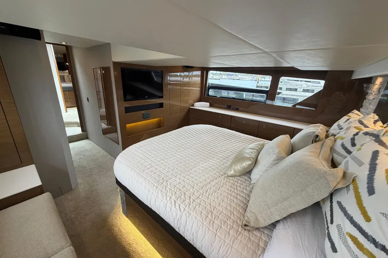 Slide: The Image of Luxurious 2018 Cruisers Yachts 50 Cantius bedroom with modern decor and large windows. - 38