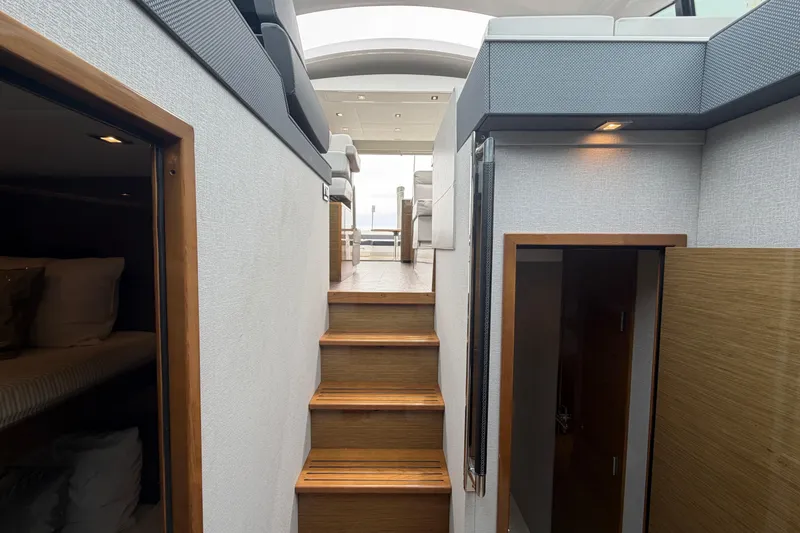 Slide: The Image of Interior view of 2018 Cruisers Yachts 50 Cantius, featuring stairs and modern design. - 47