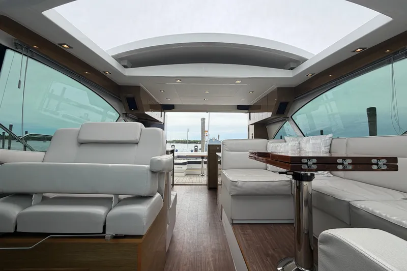 Slide: The Image of Luxurious interior of 2018 Cruisers Yachts 50 Cantius with elegant seating and panoramic windows. - 48