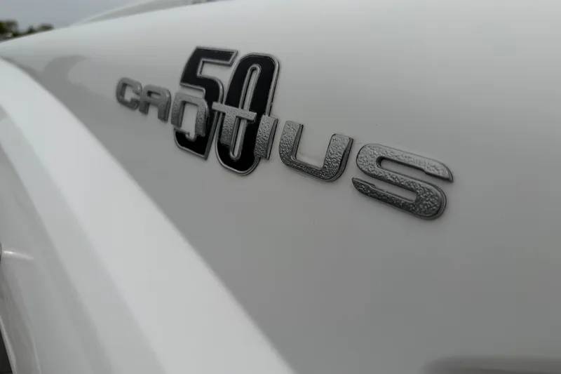 Slide: The Image of Close-up of 2018 Cruisers Yachts 50 Cantius logo on white surface. - 54