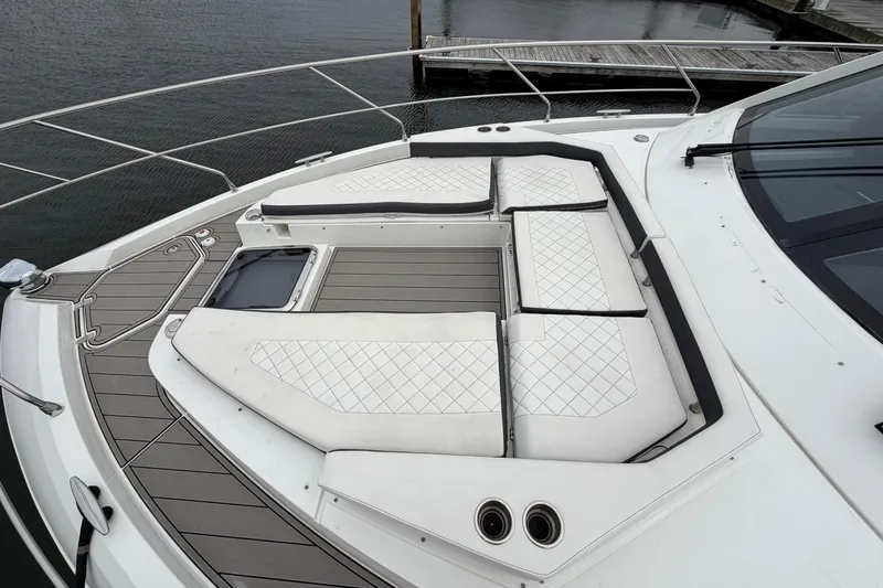 Slide: The Image of Luxurious 2018 Cruisers Yachts 50 Cantius with elegant deck seating and waterfront view. - 56