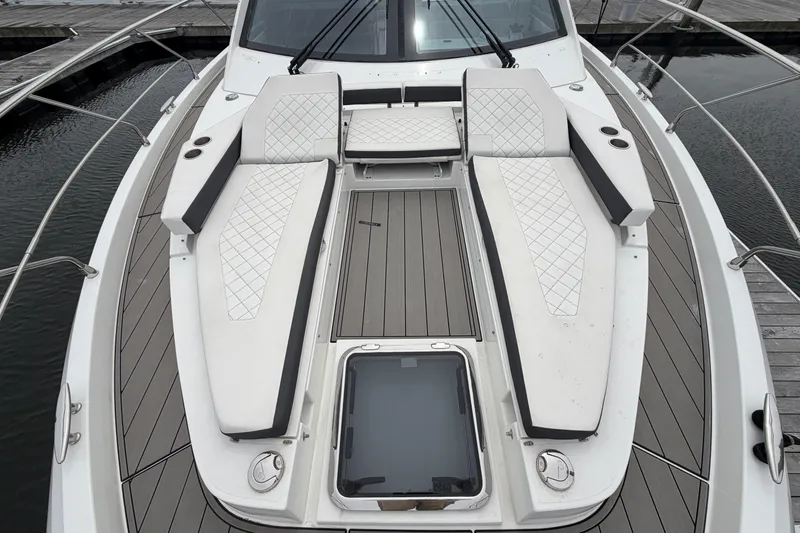 Slide: The Image of 2018 Cruisers Yachts 50 Cantius deck with cushioned seating and sleek design. - 58