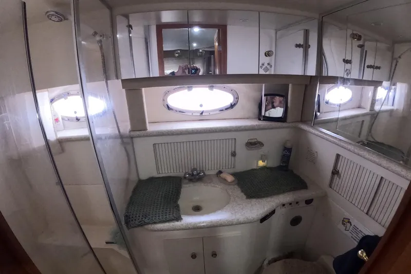Slide: The Image of Bathroom interior of 2000 Carver 406 Motor Yacht with sink and mirrors. - 11