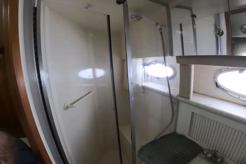 Slide: The Image of Bathroom interior of 2000 Carver 406 Motor Yacht with shower and porthole window. - 12