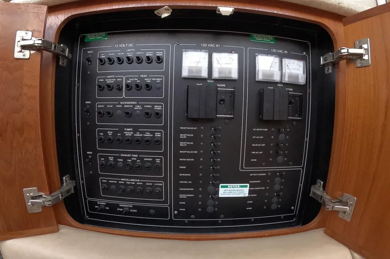 Slide: The Image of Electrical control panel inside a 2000 Carver 406 Motor Yacht, featuring switches and meters. - 13