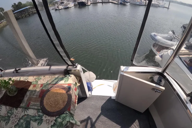 Slide: The Image of Interior view of 2000 Carver 406 Motor Yacht overlooking marina with boats. - 18