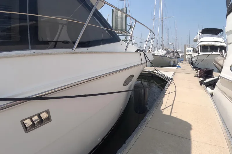 Slide: The Image of 2000 Carver 406 Motor Yacht docked at marina, side view. - 20