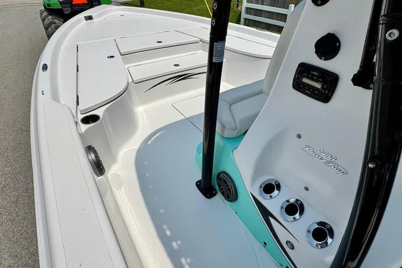 Slide: The Image of 2017 Blue Wave 2400 PureBay boat interior with seating and control panel. - 12