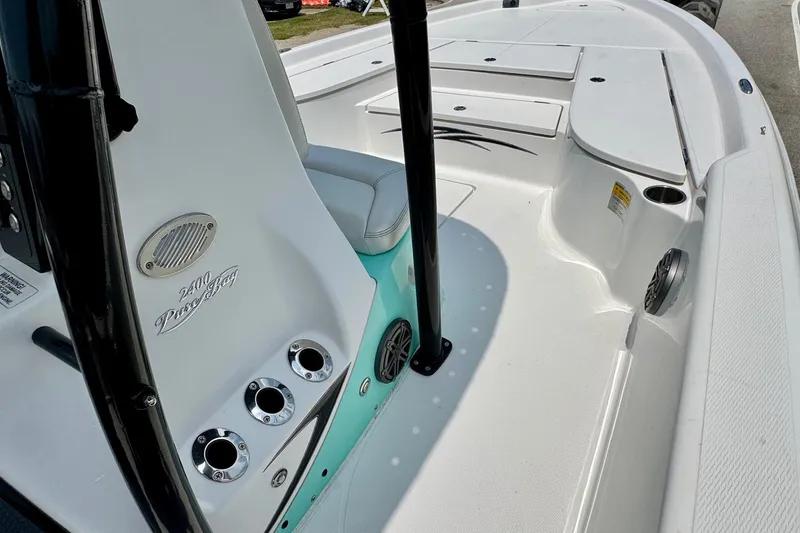 Slide: The Image of 2017 Blue Wave 2400 PureBay boat interior with seating and storage compartments. - 14