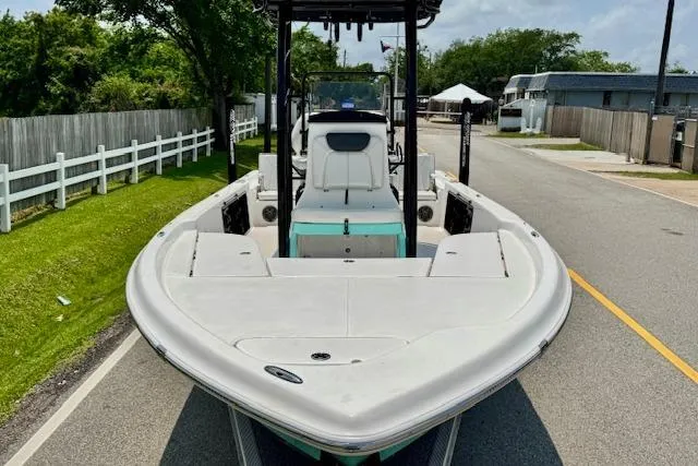 Slide: The Image of 2017 Blue Wave 2400 PureBay boat on a street, showcasing its sleek design. - 6