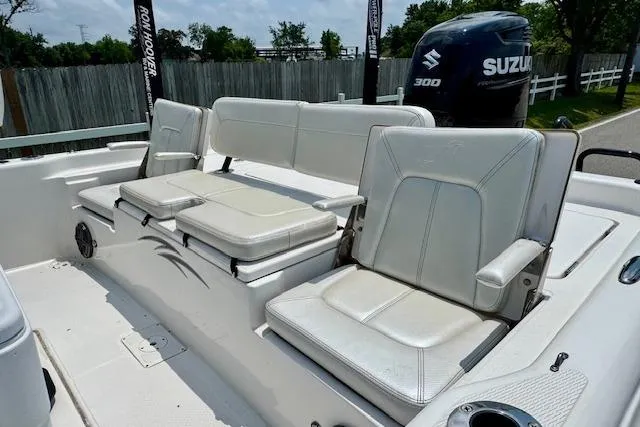 Slide: The Image of 2017 Blue Wave 2400 PureBay boat with white seating and Suzuki 300 engine. - 7