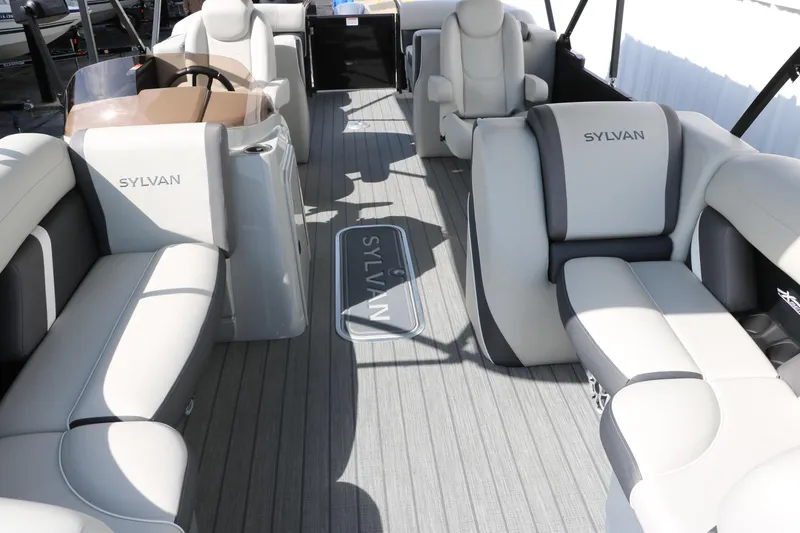 Slide: The Image of Interior of 2025 Sylvan Mirage X3 pontoon boat with luxurious seating and modern design. - 10