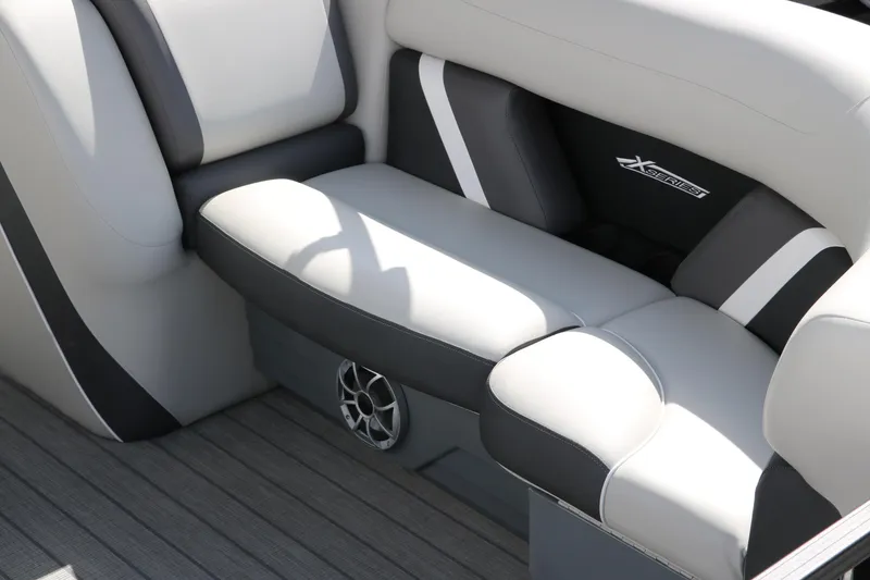 Slide: The Image of 2025 Sylvan Mirage X3 boat interior with gray and black seating. - 16