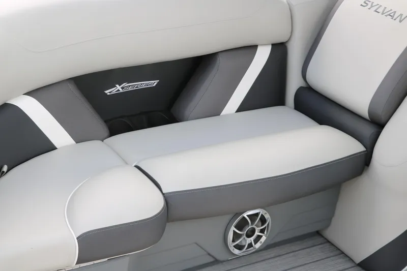 Slide: The Image of 2025 Sylvan Mirage X3 boat interior with gray and white cushioned seating. - 21