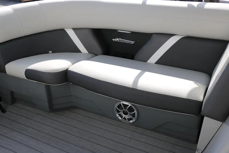 Slide: The Image of 2025 Sylvan Mirage X3 boat interior with stylish seating and speaker system. - 24