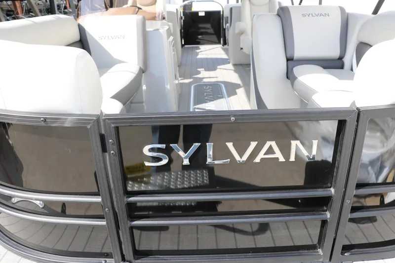 Slide: The Image of 2025 Sylvan Mirage X3 pontoon boat interior with plush seating and sleek design. - 9