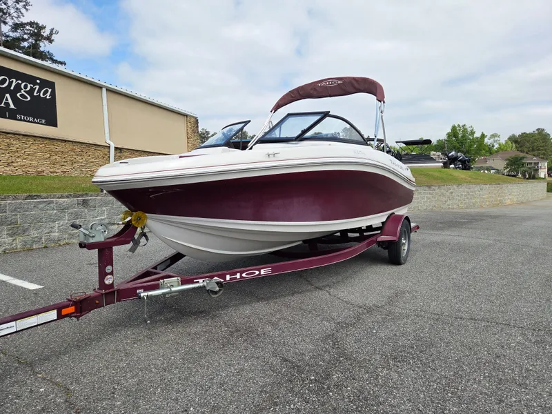 Slide: The Image of 2016 Tahoe 450 TS boat parked on trailer. - 5
