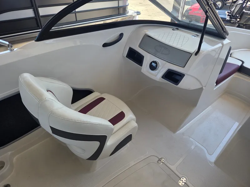 Slide: The Image of Interior of a 2016 Tahoe 450 TS boat with helm console. - 6