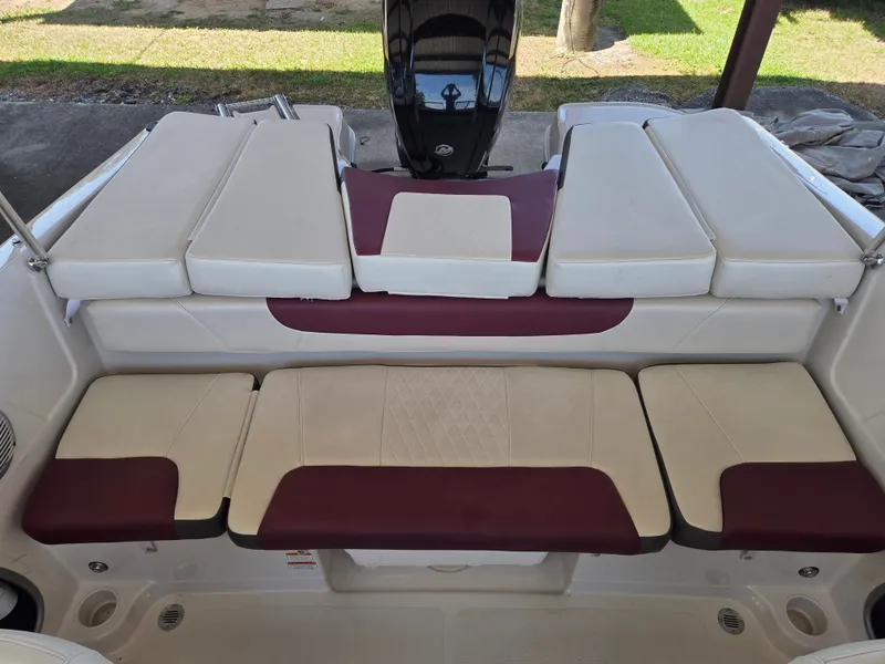 Slide: The Image of Interior of a 2016 Tahoe 450 TS boat with cushioned seating. - 8