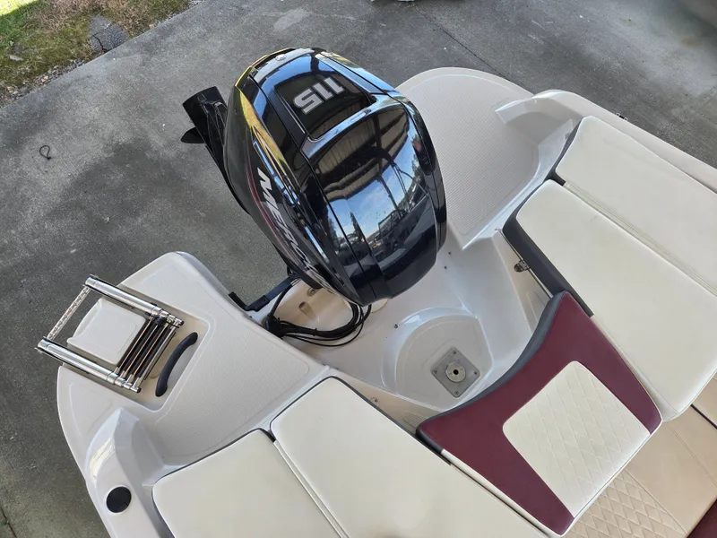 Slide: The Image of Rear view of a 2016 Tahoe 450 TS boat with engine. - 9