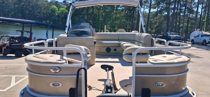 Slide: The Image of 2013 SunCatcher X22 FC pontoon boat parked by the lakeside. - 2