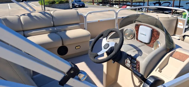 Slide: The Image of Interior of a 2013 SunCatcher X22 FC pontoon boat with Garmin controls. - 6