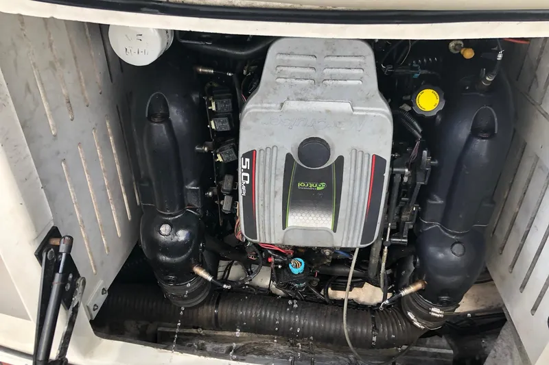 Slide: The Image of Engine compartment of a 2012 Sea Ray 210 SLX boat, featuring a 5.0 MPI engine. - 15