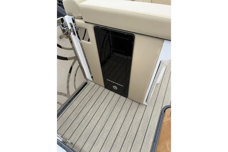 Slide: The Image of Interior of 2025 Balise Helix 26 L boat with beige seating and patterned flooring. - 11