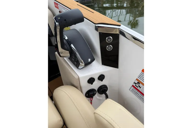 Slide: The Image of Control panel of 2025 Balise Helix 26 L boat with throttle and switches. - 16