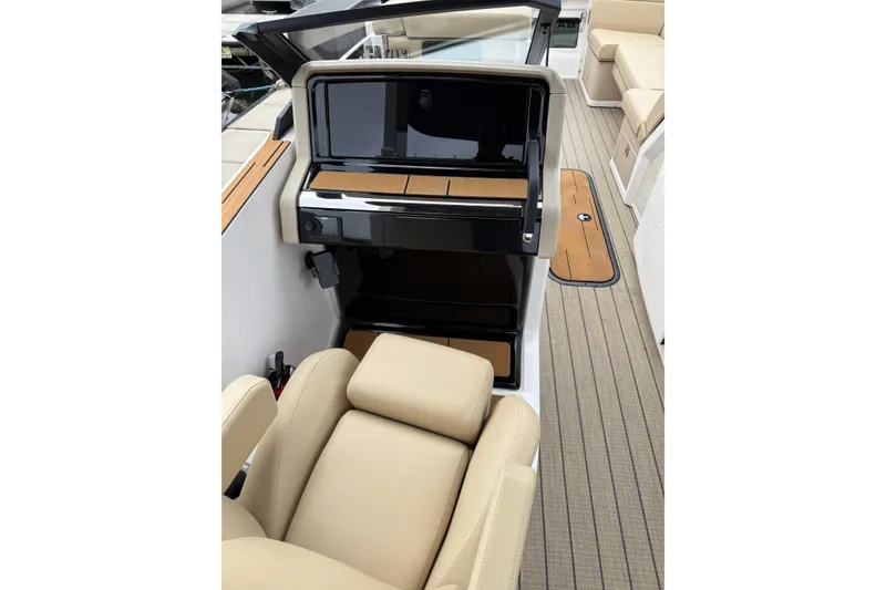 Slide: The Image of Interior view of 2025 Balise Helix 26 L boat with beige seating and sleek design. - 17