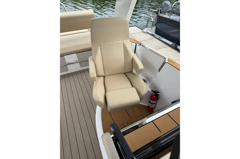 Slide: The Image of Luxurious beige captain's chair on Balise Helix 26 L boat, 2025 model. - 18