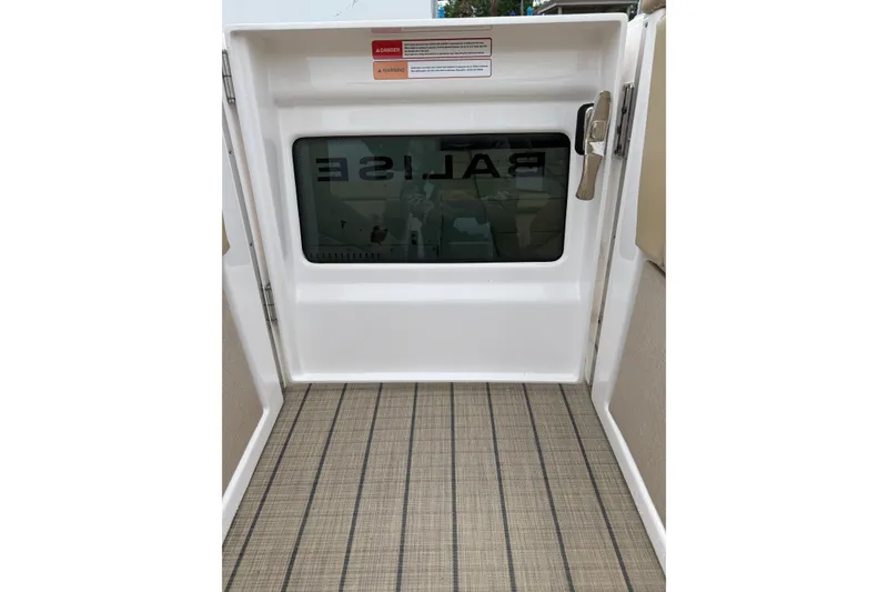 Slide: The Image of Interior view of Balise Helix 26 L 2025 boat door with window and handle. - 24