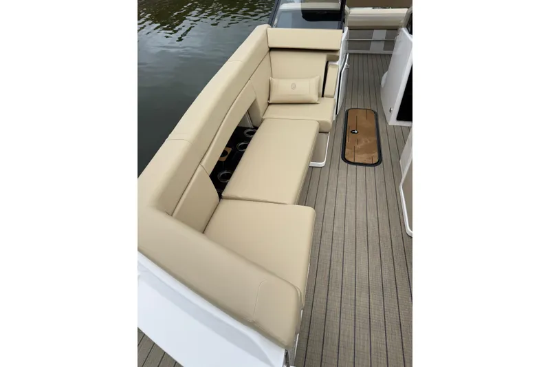 Slide: The Image of Luxurious seating on the 2025 Balise Helix 26 L boat, featuring beige upholstery and sleek design. - 25
